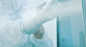 Should Personnel Sanitize Their Gloves During a Media Fill Test?